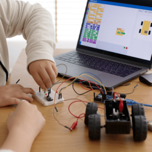 Students studying electronics and engineering using models and edtech platforms
