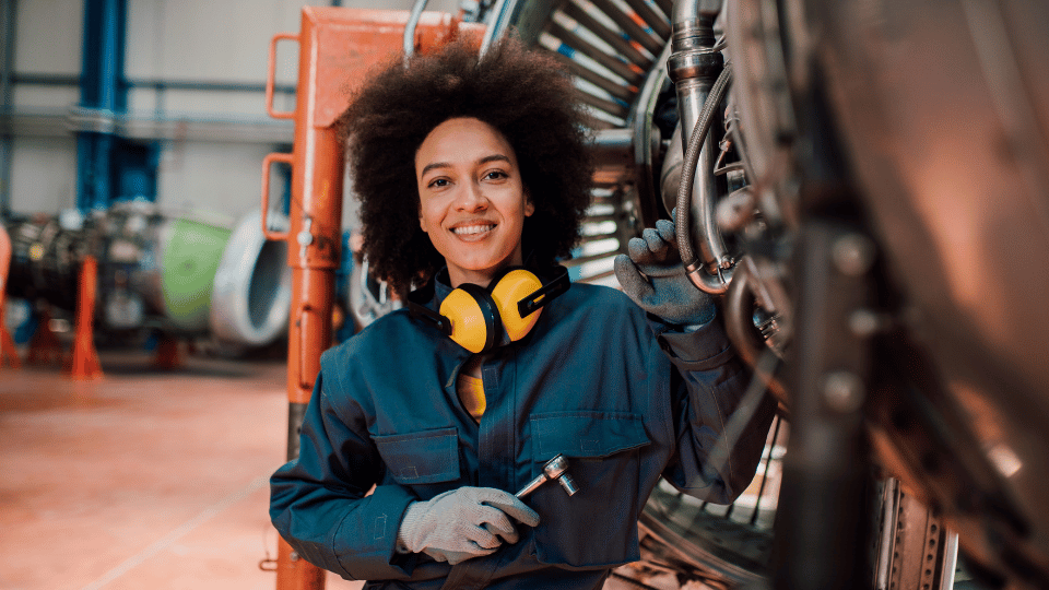 Female engineer working on an engine