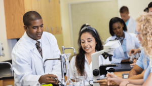 Science students in a school science lab with their teacher
