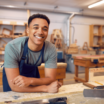 A carpentry student in a carpentry lab